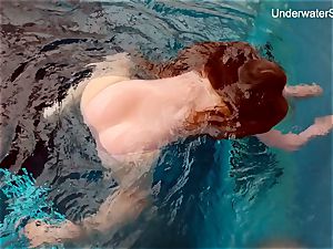 sandy-haired Simonna demonstrating her body underwater